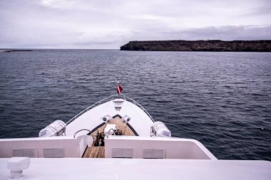 separate parts of a safari ship against the background of the sea and islands 