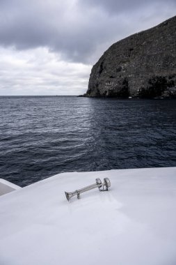 uninhabited islands of the Galapagos orchipelago from a safari ship on the background of the sea 