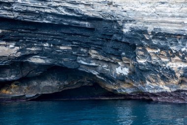typical landscape of the uninhabited islands of the Galapagos archipelago against the backdrop of the sea and sky 