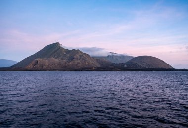 typical landscape of the uninhabited islands of the Galapagos archipelago against the backdrop of the sea and sky 