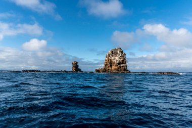 landscape with uninhabited islands in the Galapagos archipelago against the backdrop of the sea and blue sky 