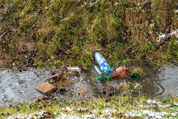 Bottles on river, nature pollution series