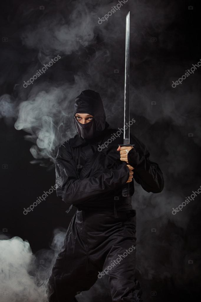 Ninja with sword in smoke — Stock Photo © fotokvadrat 50579363