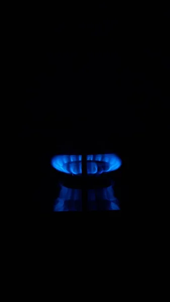 Flame Gas, Household energy consumption. Black color background. Increased costs in the bill.