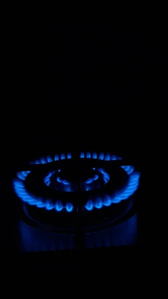 Flame Gas, Household energy consumption. Black color background. Increased costs in the bill.