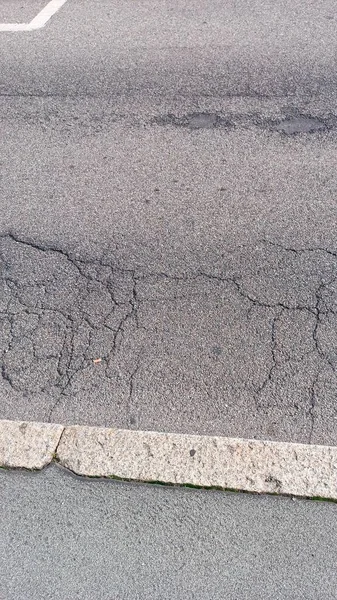 Sidewalk Close-up - Street in the City. Partial section of the sidewalk at the edge of the road.