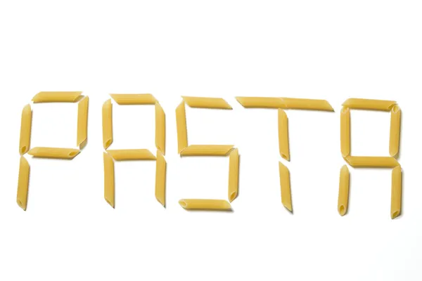 Pasta letters made out of pasta pieces isolated on a white background — Stock Photo, Image