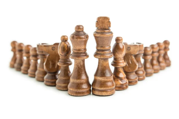 Wooden chess pieces aligned isolated on white background — Stock Photo, Image