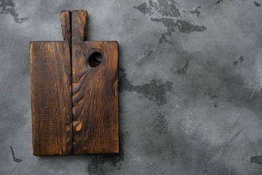 Eski ahşap mutfak tahtası seti, üst görünüm düz yatak, metin veya yemek için kopyalama alanı, gri taş masa arkaplanı