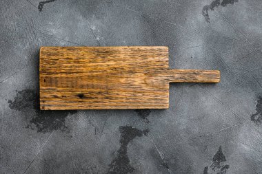 Boş sunucu tahtası seti, üst görünüm düzlüğü, metin veya ürününüz için kopyalama alanı, gri taş masa arkaplanı üzerinde