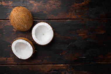 Coco pieces set, on old dark  wooden table background, top view flat lay, with copy space for text