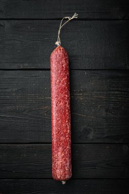 Delicious sausage set, on black wooden table background, top view flat lay, with copy space for text