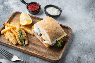 Sandwich with Fish Sticks set, on gray background , with copyspace  and space for text