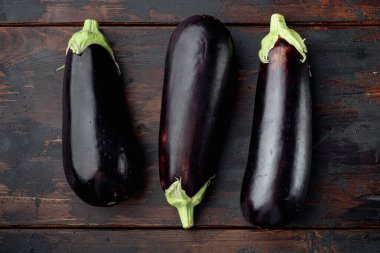 Eggplant,  aubergine organic ripe whole vegetables set, on old dark  wooden table background, top view flat lay