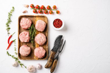 Home made raw meatballs set, on white stone table background, top view flat lay, with copy space for text