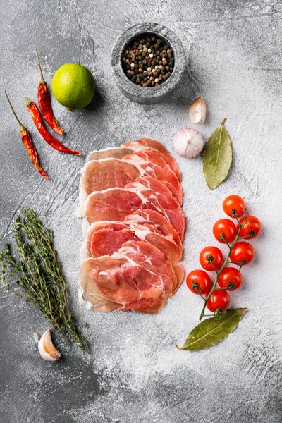 Thin Slices Prosciutto Set Gray Stone Table Background Top View — Stock Photo, Image