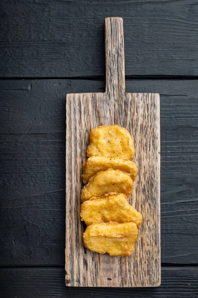 Fried Crispy Chicken Nuggets Meat Black Wooden Background Flat Lay — стоковое фото