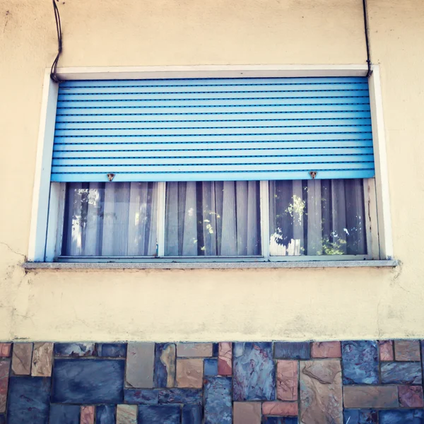Window with blue roller shutter — Stock Photo, Image