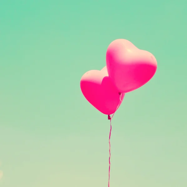 Heart balloons on vintage sky — Stock Photo, Image