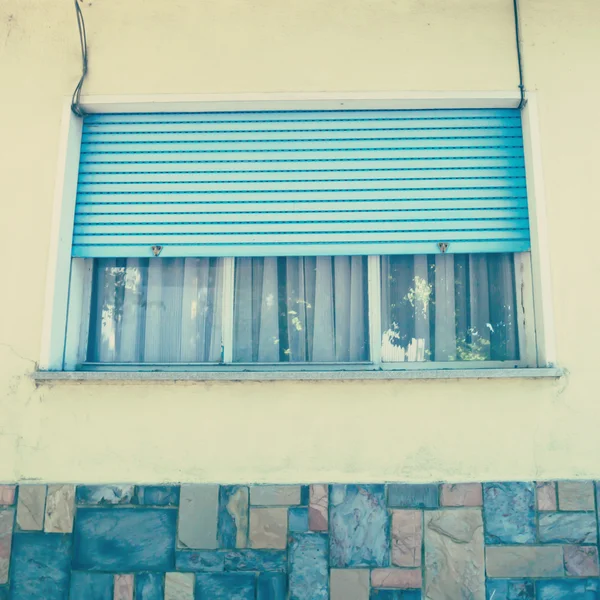 Window with blue roller shutter — Stock Photo, Image