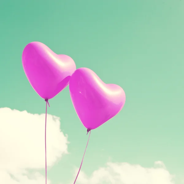 Purple heart balloons on mint sky — Stock Photo, Image