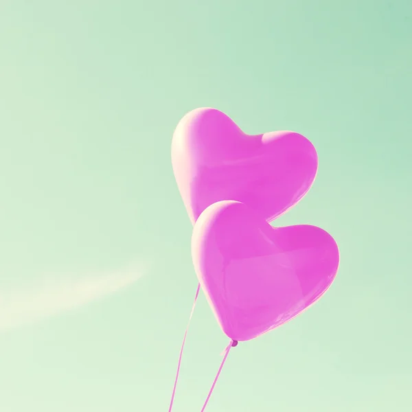 Purple heart balloons on mint sky — Stock Photo, Image