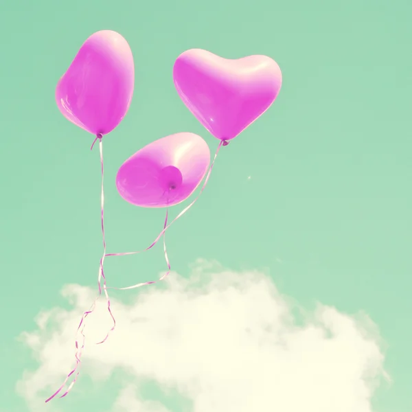 Purple heart balloons on mint sky — Stock Photo, Image