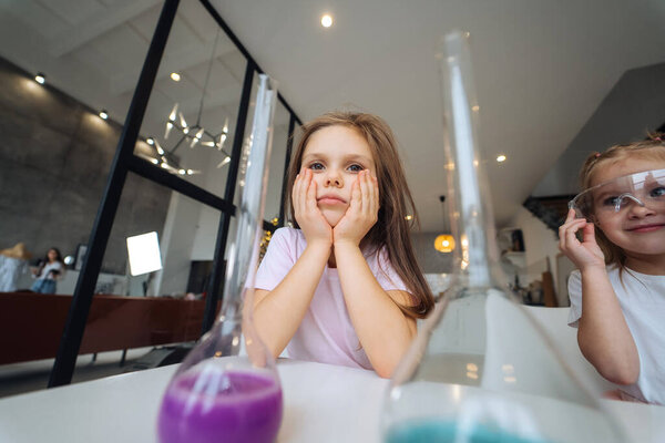 Little girls making chemical experiments at home Stock Image