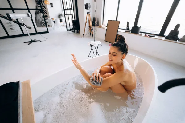 Woman Rubbing Her Arm Sponge While Taking Bath — Stock Fotó