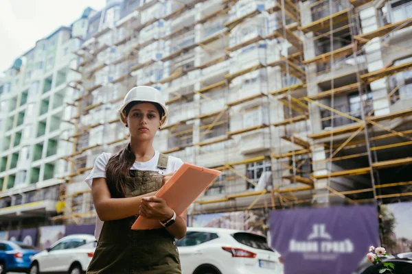 Woman construction engineer wear safety white hard hat at construction site industry worker. Woman construction Engineer concept