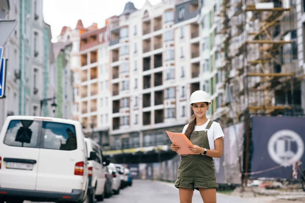 Woman construction engineer wear safety white hard hat at construction site industry worker. Woman construction Engineer concept