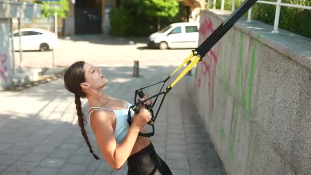 Attractive Sporty Woman Doing Suspension Exercises Straps Intense Workout Urban — Stockvideo