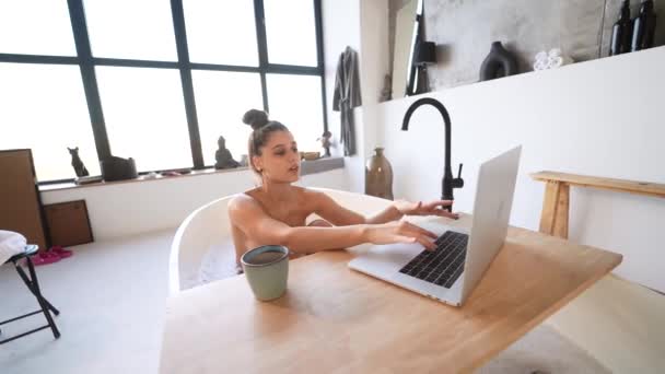 Young Woman Working Laptop While Taking Bathtub Home — ストック動画