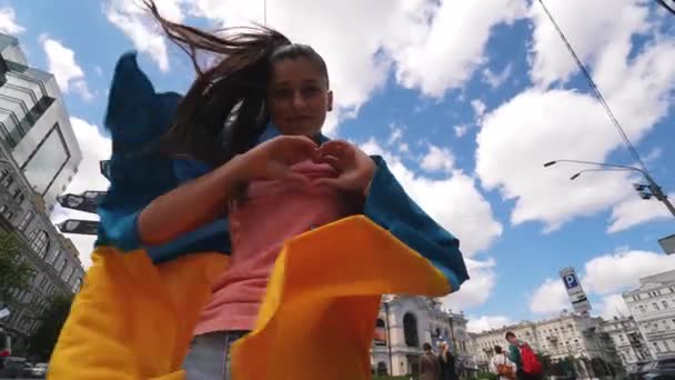 Young Woman Ukrainian Flag Shoulders Shows Heart Hands — Vídeos de Stock