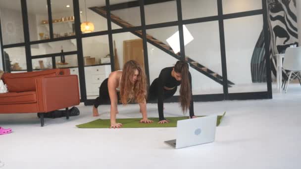 Two Girls Practice Yoga Home — Wideo stockowe