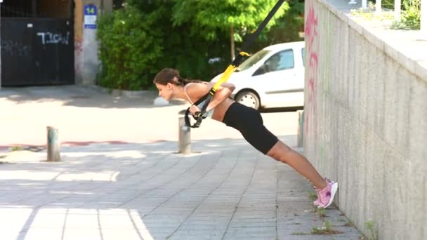 Attractive Sporty Woman Doing Suspension Exercises Straps Intense Workout Urban — 图库视频影像