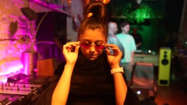 Beautiful female dancing to techno
