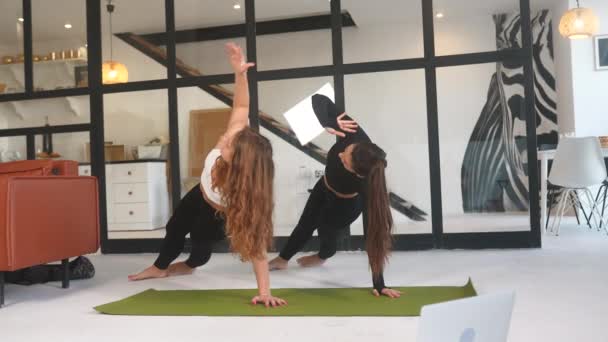 Two Girls Practice Yoga Home — Vídeos de Stock