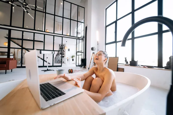 Young Woman Working Laptop While Taking Bathtub Home — 스톡 사진