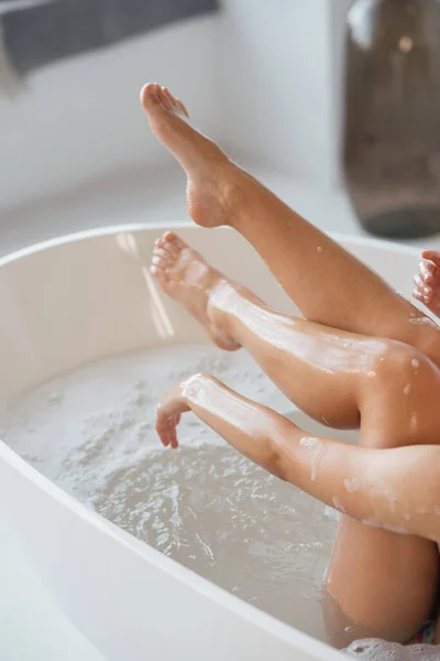 Cropped View Young Woman Lying Foamy Bath Demonstrating Silky Skin — Zdjęcie stockowe