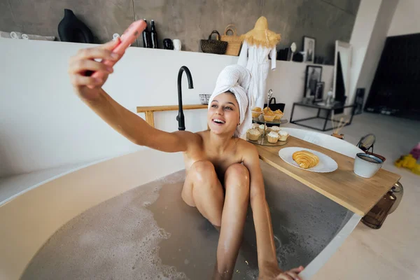 Woman Taking Selfie While Taking Bath — Stock Fotó