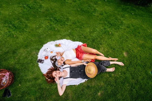 Two Women Having Picnic Together Laying Plaid Lawn — 图库照片