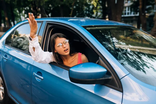 Young Angry Woman Peeks Out Car Window Woman Shows Her — 스톡 사진