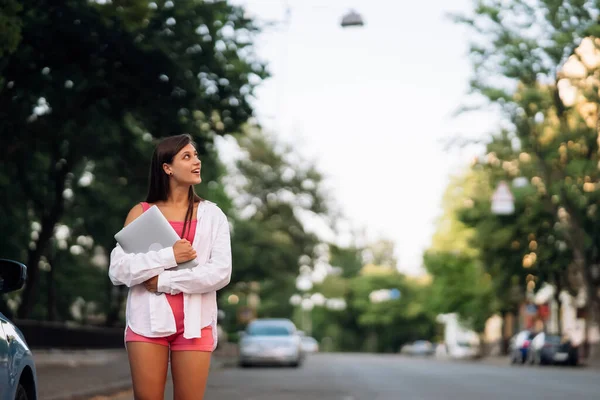 Image Young Cheerful Beautiful Woman Walking Outdoors Holding Laptop Computer — Stockfoto