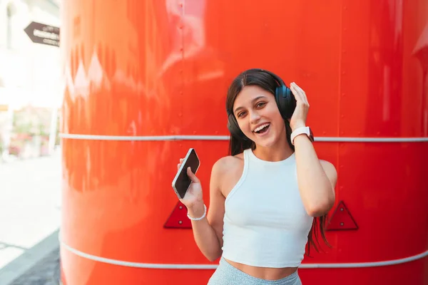 Portrait Happy Girl Listening Music Online Wireless Headphones Smartphone Street — стоковое фото