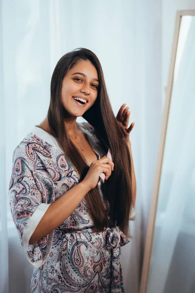 Woman Combing Hair Front Her Mirror — Stock Photo, Image