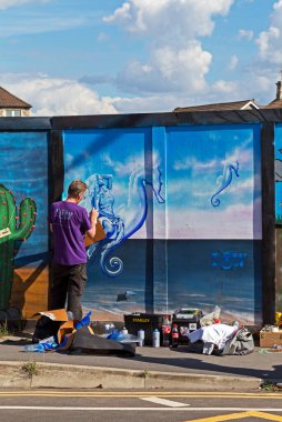 Artist Ian Boyd Walker at work at a paint jam at the site of the former police station in Weston-super-Mare, UK on 27 August 2022.