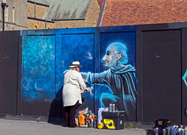 An artist at work at a paint jam at the site of the former police station in Weston-super-Mare, UK on 27 August 2022.