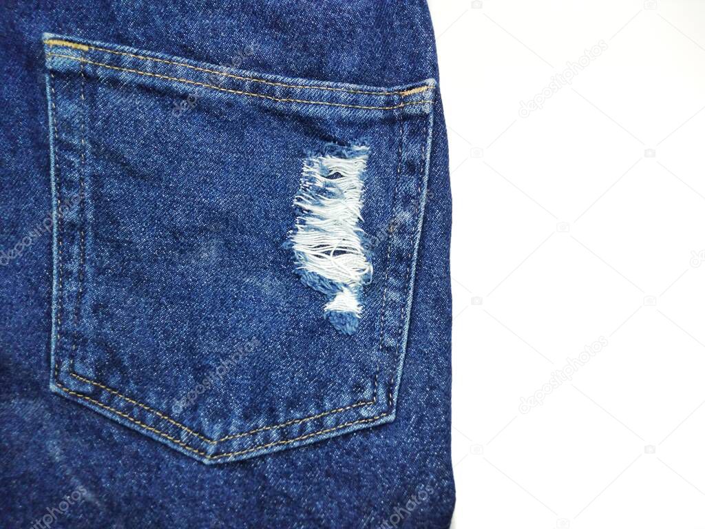 The blue jeans texture has a tear, see the white fabric inside. Giving a new perspective that has never been seen White background copy space