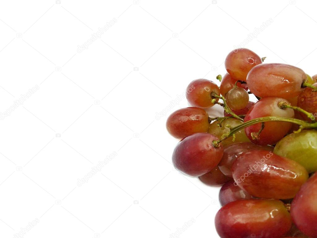 Bunch of red grapes on white background concept. Nutritious consumption of fruit and helps in weight management.  Gives a sweet and sour feeling